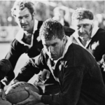 Colin Meads handling the rugby ball during a 1971 match.