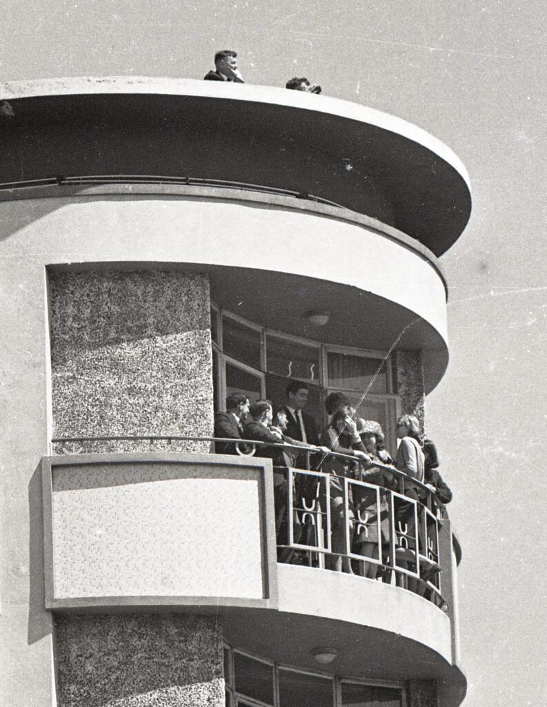 Secret Service agents keep a lookout over Wellington while President Lyndon Johnson visits the capital, 1968