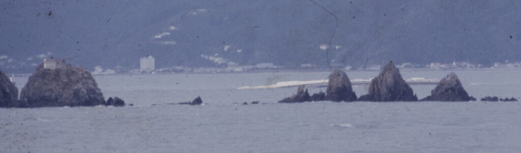 Colour photograph of Wahine sinking in Wellington Harbour, 1968